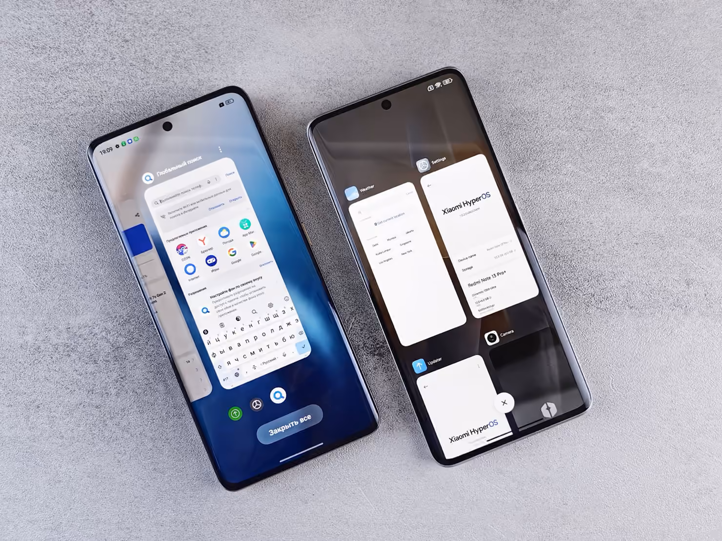 Two Android smartphones side by side on a grey surface, each showing open app windows, as they would be laid out for device testing.