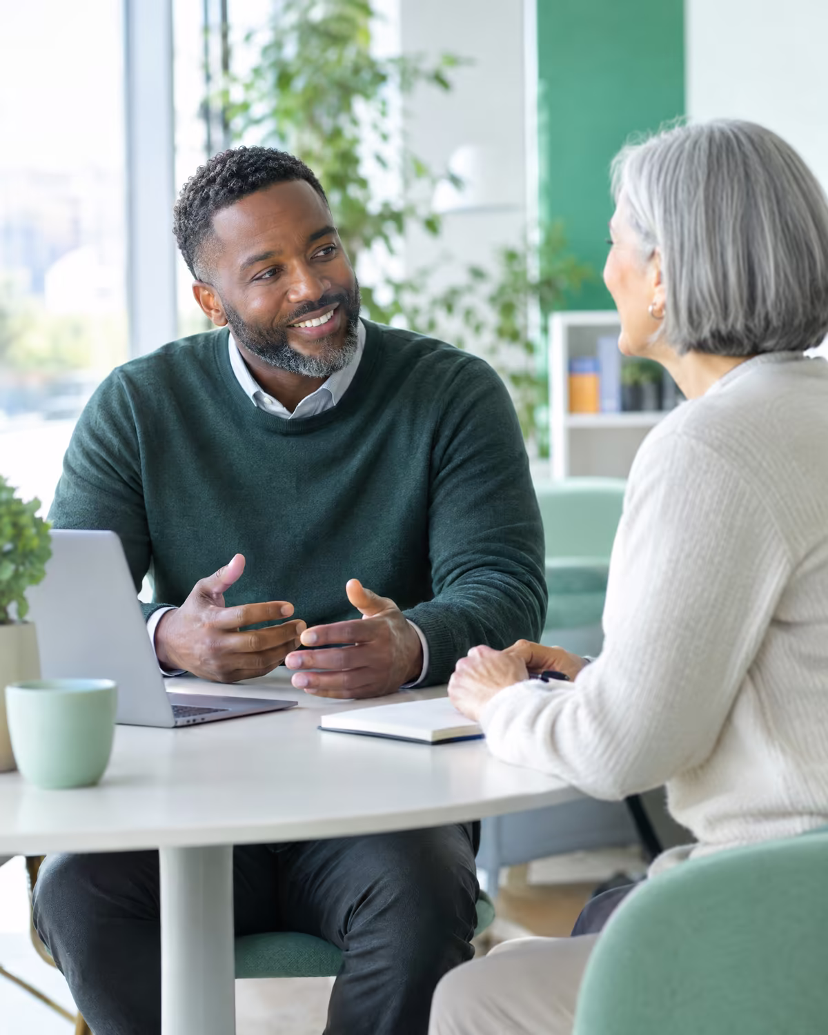 A manager and colleague in a one-on-one meeting