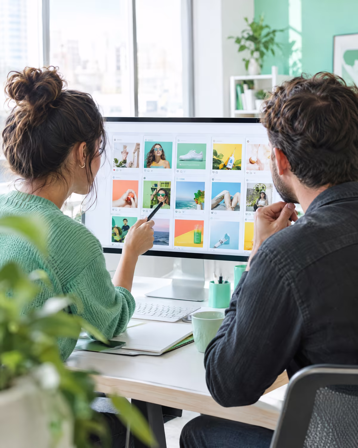 Two creatives comparing social ad variations on a screen